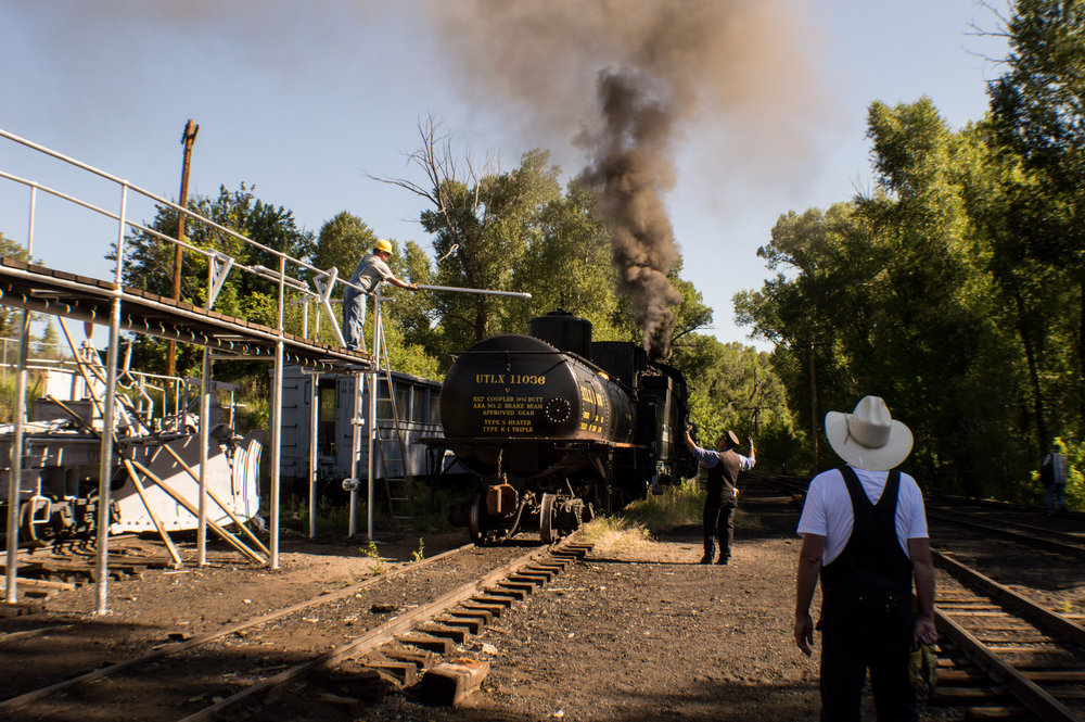 13 Conductor Ray works with the Friends at the Gramps Oil loading rack to position a tank car.jpg