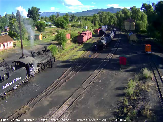 8.13.16 As coal is added to the bunker of 489 the road crewmember oils around.jpg