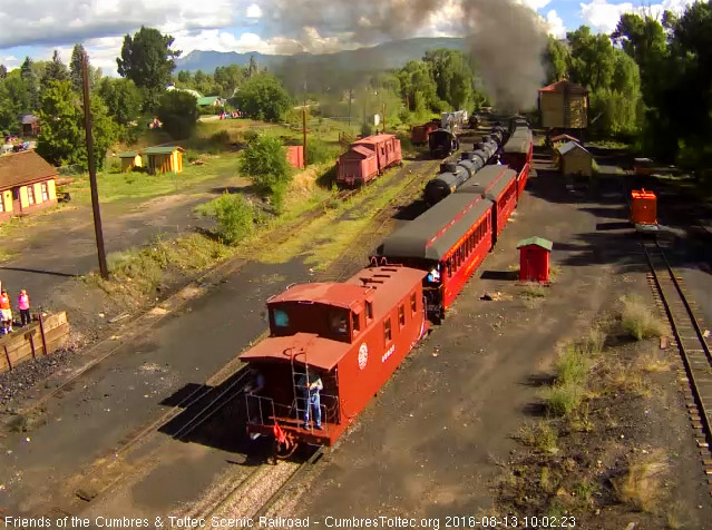 8.13.16 One of the people who chartered the caboose is on the rear platform.jpg