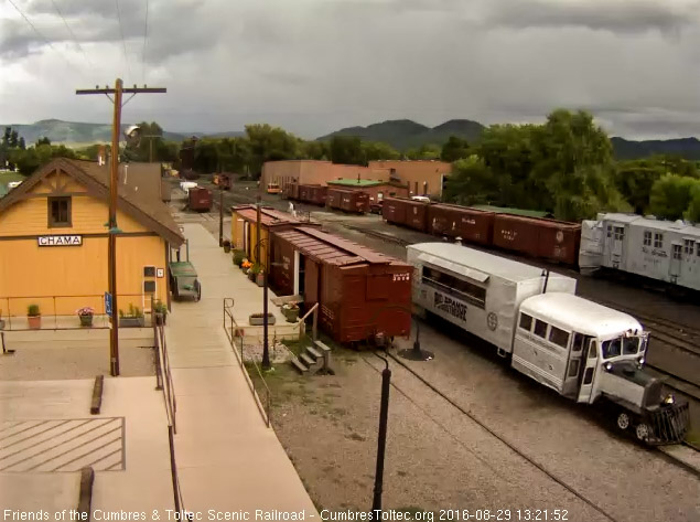 8.29.16 Goose 5 passes the depot with rain in the background.jpg