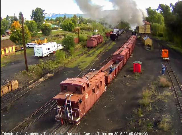 9.5.16 Someone is enjoying the early morning ride on the caboose's back platform.jpg