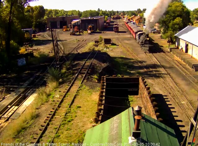 9.5.16 The 487 passes an open wood shop as someone watches from the dockl.jpg