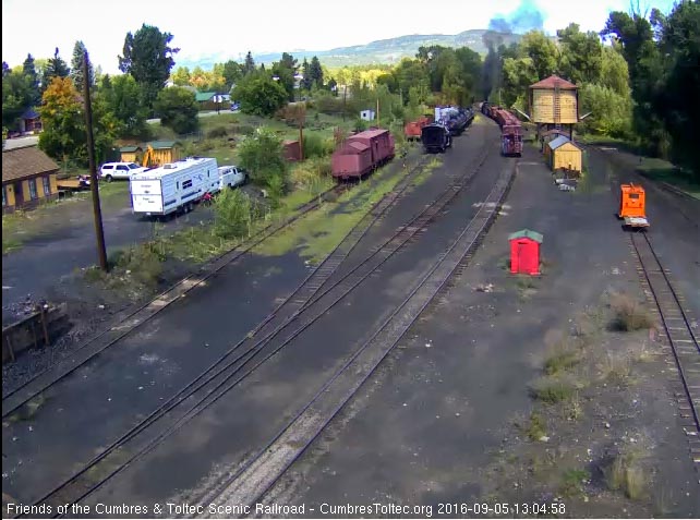 9.5.16 Clearing Chama yard under a real cloud.jpg