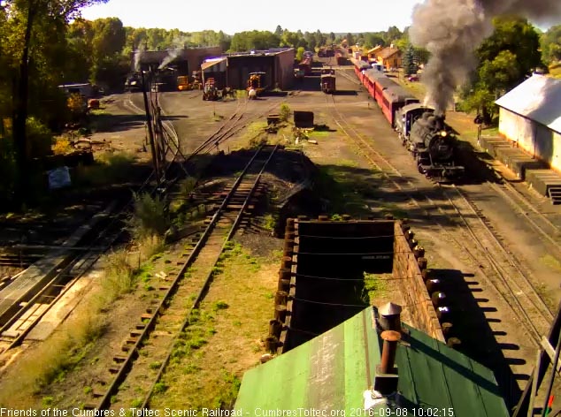 9.8.16 484 brings the train by the wood shop as it gets moving out of Chama.jpg