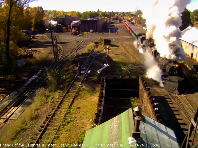 9.24.16 Nice steam in this cold air as the train passes the wood shop.jpg