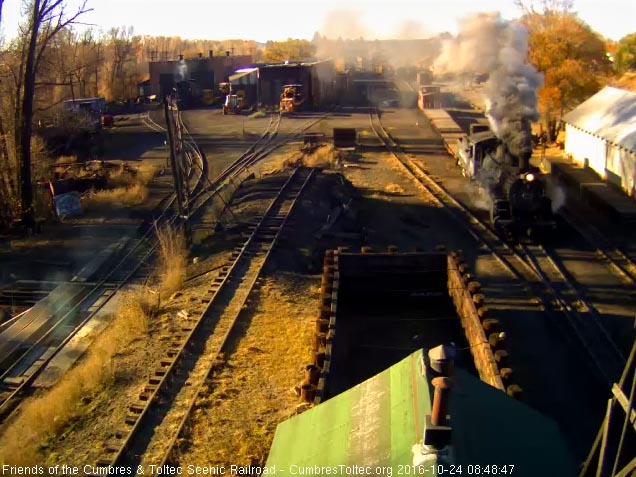 10.24.16 484 comes out of south yard with a caboose attached to the flats.jpg