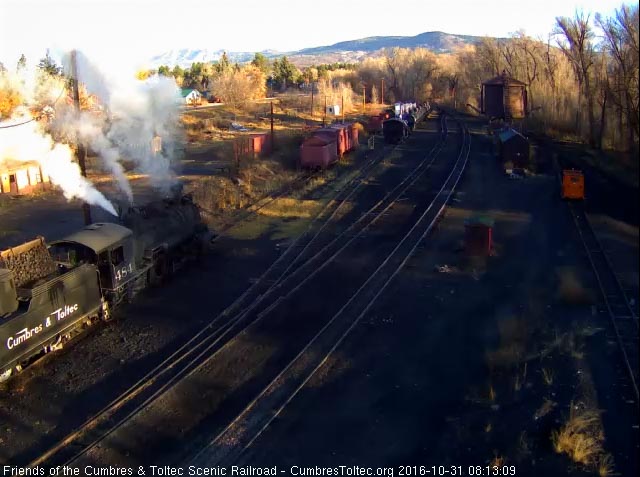 10.31.16 484 has coal added to its bunker as the early morning sun glints off the tender.jpg