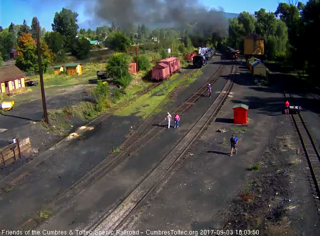 9-3-17 As fans walk back to their cars, the train is clearing Chama yard.jpg