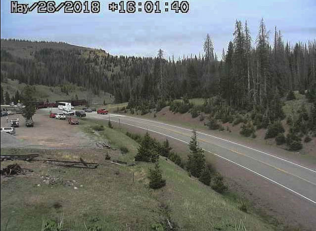 2018-05-26 Switching continues at the pass as the back 4 cars of 215 sit on the highway crossing.jpg