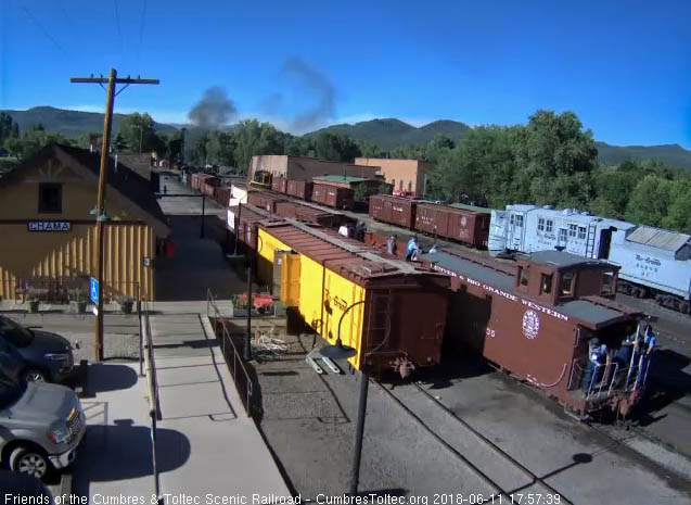 2018-06-11 The caboose passes the depot as it heads to the south yard lead.jpg