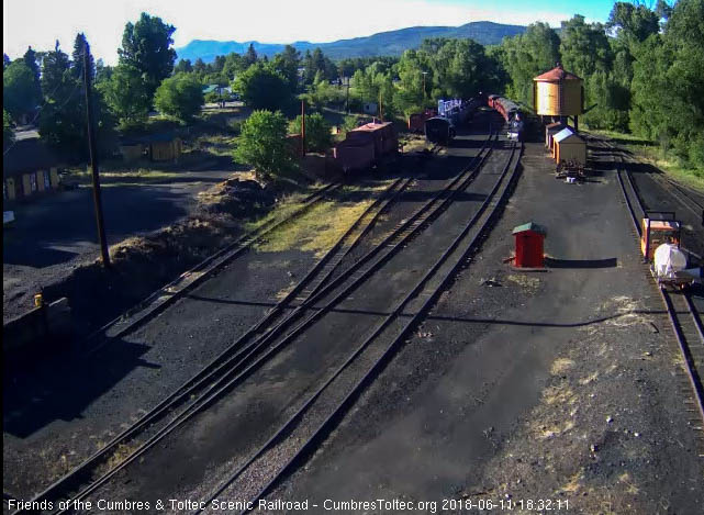 2018-06-11 The 487 comes by the tank as the headlight of the fire patrol speeder is seen behind the train.jpg