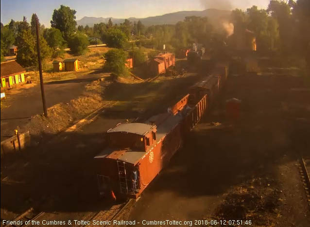2018-06-12 The lingering smoke almost obscures the train as the caboose is by the tipple.jpg