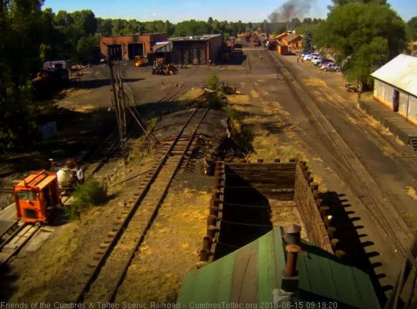 2018-06-15 The 487 is now coupled to its train as one of the fire patrol speeders fills its water tank.jpg