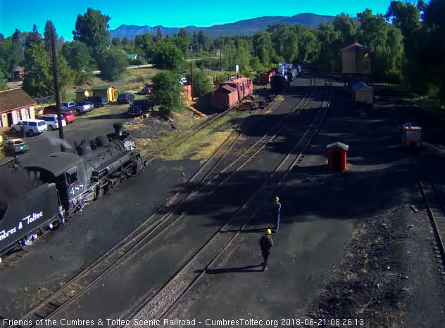 2018-06-21 Coal dust flys up as the loader dumps a bucket of coal into the tender.jpg