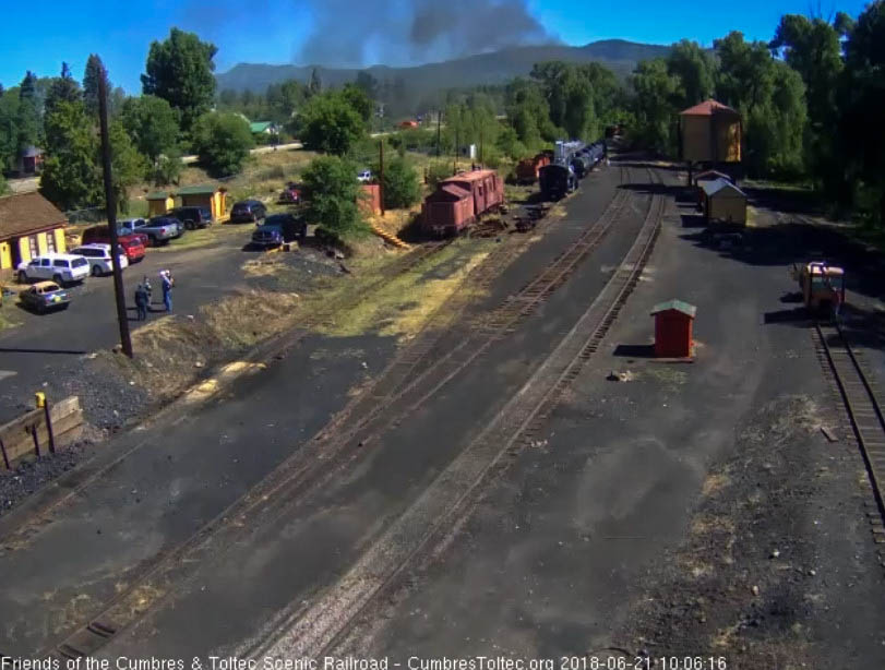 2018-06-21 The last cars of the train are rounding the curve as the fire truck is over on route 17.jpg