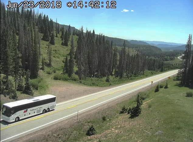 2018-06-23 One of the buses used by the railroad approaches Cumbres on route_.jpg