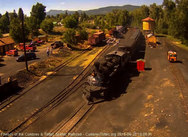 2018-06-25 The 489 comes up to the tipple with its 8 car train as the light of the following speeder is seen.jpg