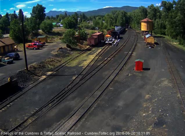 2018-06-28 The 487 brings a 9 car train 215 into Chama.jpg