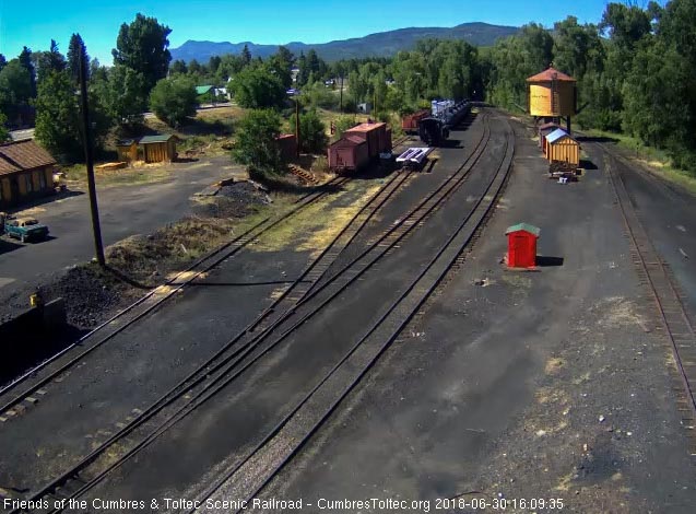 2018-06-30 The headlight of the 488 shines out of the shadows as it brings the 8 car train 215 into Chama.jpg