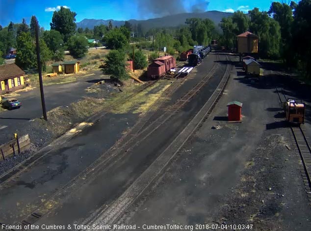 2018-07-04 The last cars of the train catch the sun as they round the curve.jpg