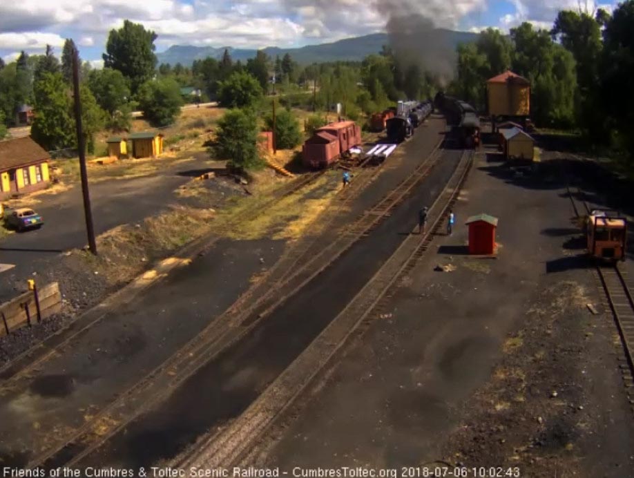 2018-07-06 The parlor Colorado passes the tanks as the locomotives have left the yard.jpg