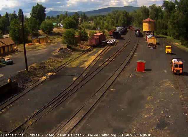 2018-07-07 The 484 is passing the tank with its 7 car train.jpg