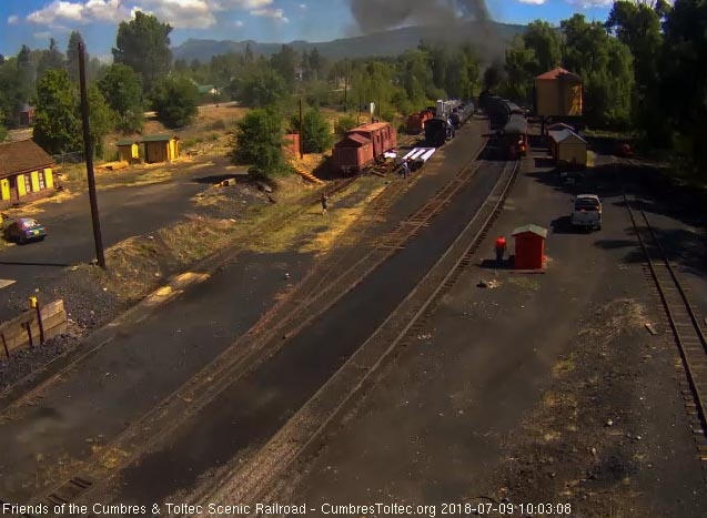 2018-07-09 The parlor New Mexico is passing the speeder sheds as the 2 locomotives clear the yard.jpg