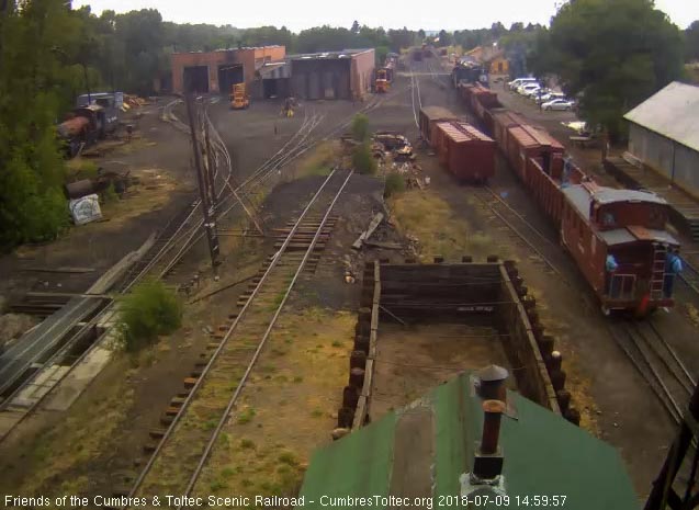 2018-07-09 The caboose is passing the woodshop as the conductor looks out.jpg