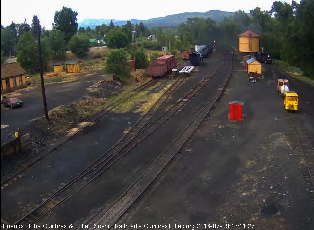 2018-07-09 We see the headlight of 487 as it enters Chama while 484 is washing its coal.jpg