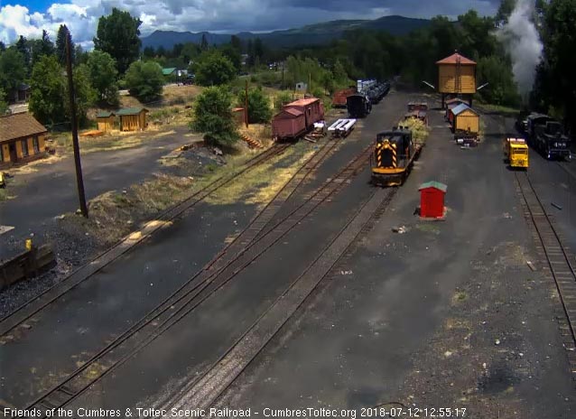 2018-07-12 The 15 is returning to Chama with a flat car loaded with brush.jpg