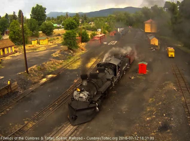 2018-07-12 The 487 comes up to the tipple as the speeder's headlight is seen in the background.jpg