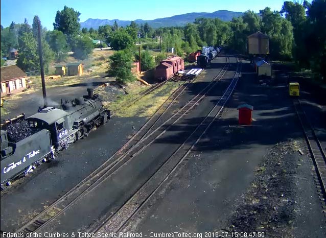 2018-07-15 The loader dumps a bucket load of coal into the tender of 489 for its trip east.jpg