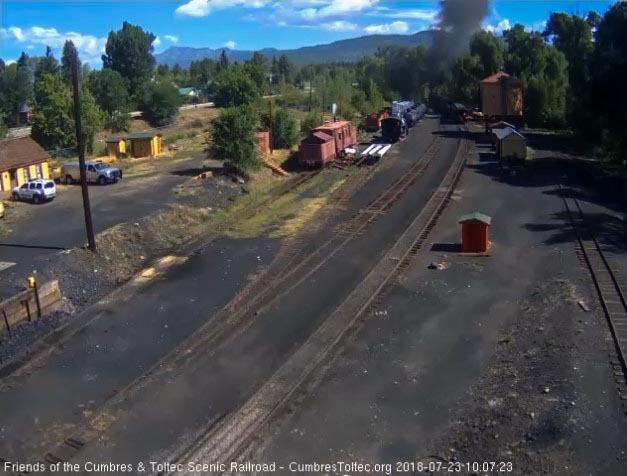 2018-07-23 The train is exiting Chama yard as the New Mexico passes the speeders.jpg