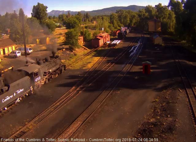 2018-07-24 Coal dust billows up as the loader dumps a bucket full into the almost empty tender of 489.jpg