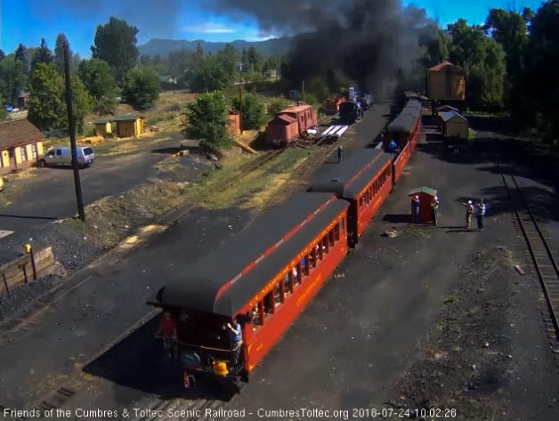 2018-07-24 Several passengers are on the platform of the parlor as it come past the tipple.jpg