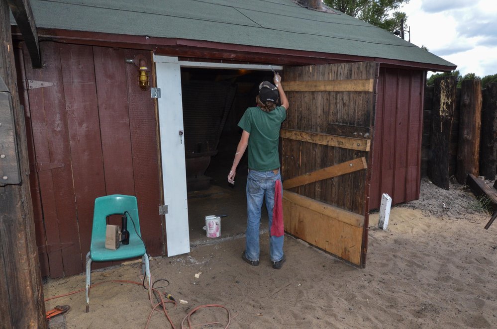 2018-07-25 The door of the sand house gets a touch up.jpg