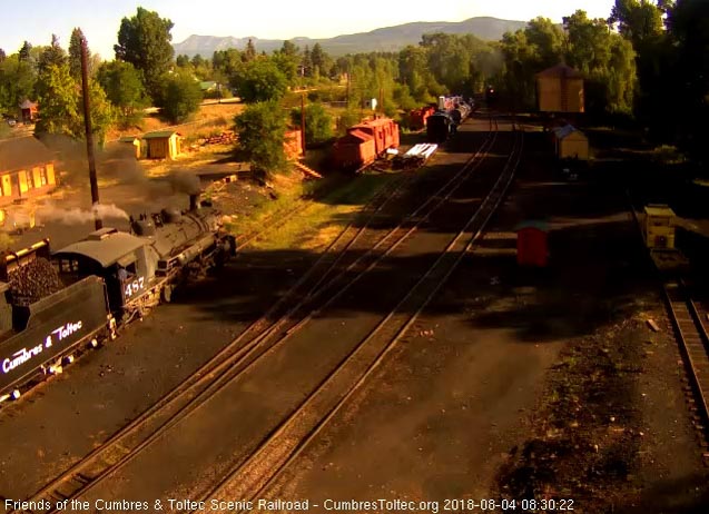 2018-08-04 The loader dumps coal into the bunker of 487 as 463 is at the yard throat.jpg