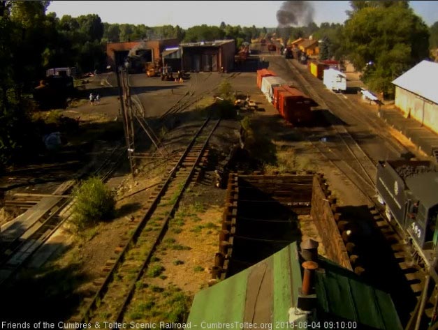 2018-08-04 The 487 has now shoved the extra coach onto the train as 463 waits to back down.jpg