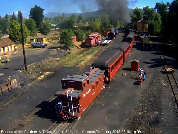 2018-08-04 The conductor is still on the caboose platform as it comes out from the tipple.jpg