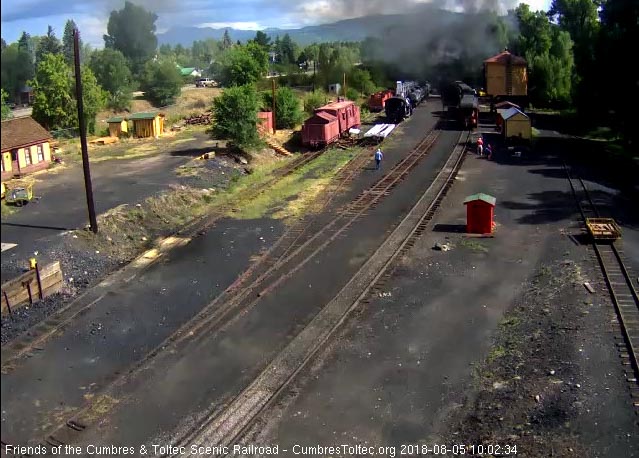 2018-08-05 The 484 is exiting the yard as the palor passes the tank.jpg