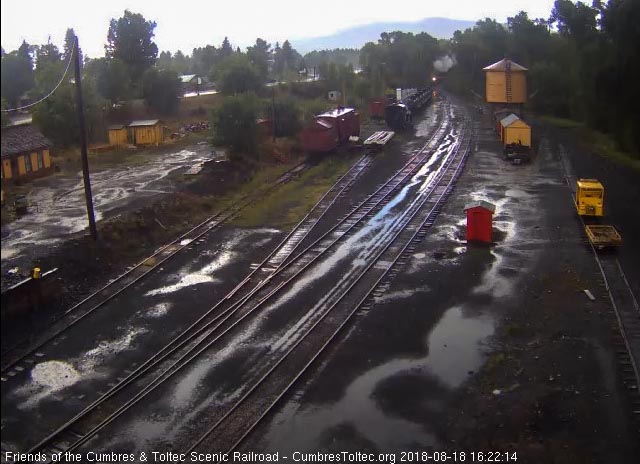 2018-08-18 The 489 brings a 7 car train 215 into a wet Chama.jpg