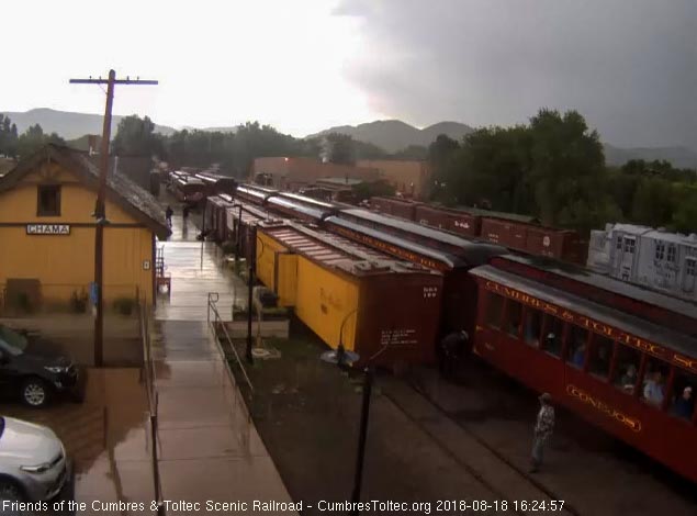 2018-08-18 The train is stopped and the conductor is placing the step box at the first coach.jpg