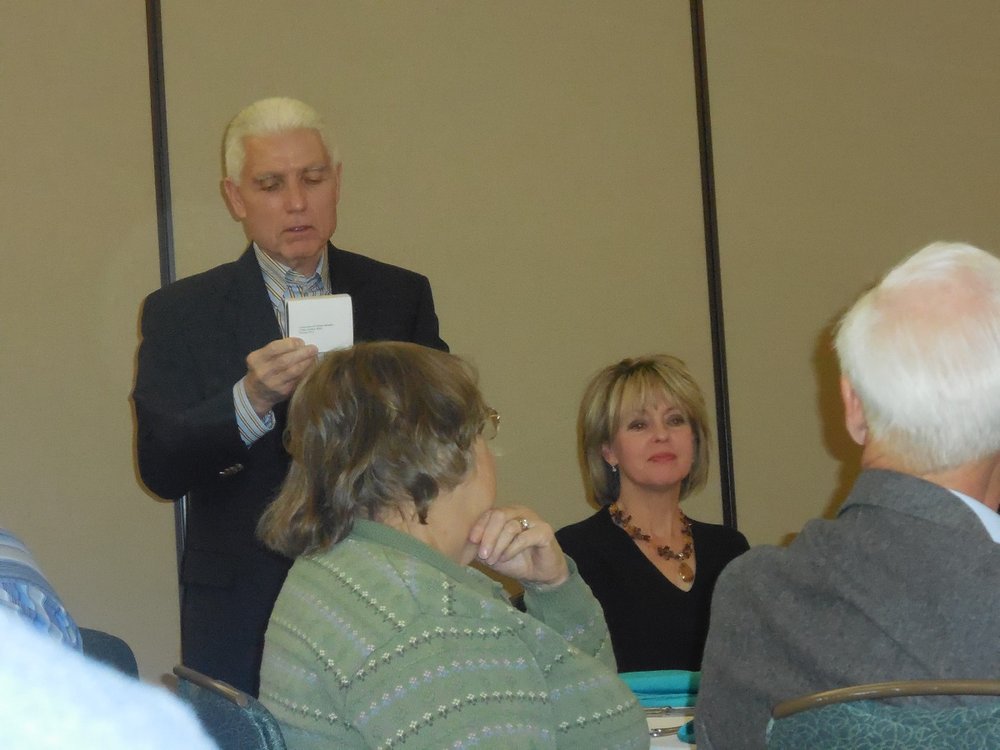 Bob Craine briefs members on new medallion program (L-R, Judy Lock, Debbie Craine, Bill Lock).jpg