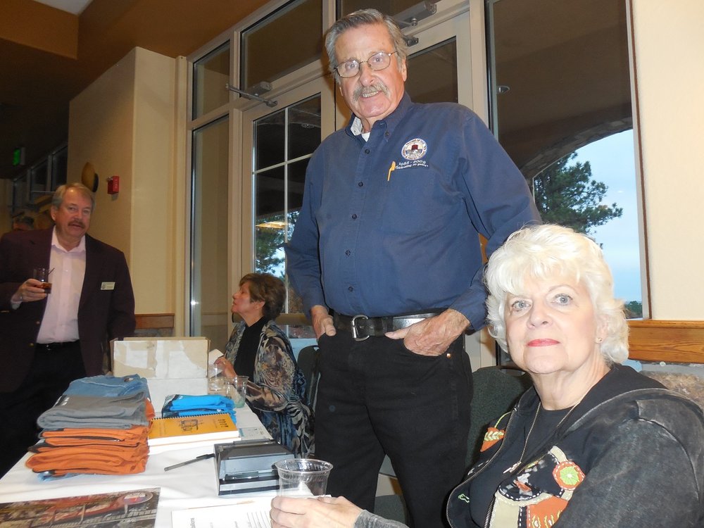 Bob and Holly Ross are ready for merchandise sales - 10-25-2013.jpg