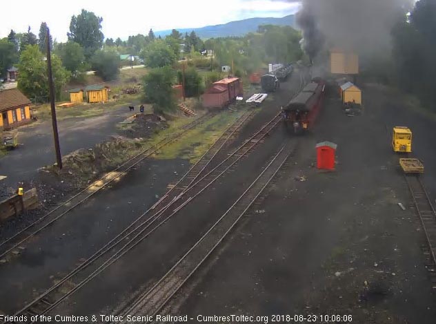 2018-08-22 After he sees the drop in air pressure, the conductor has raised his arm to signal the locomotive.jpg