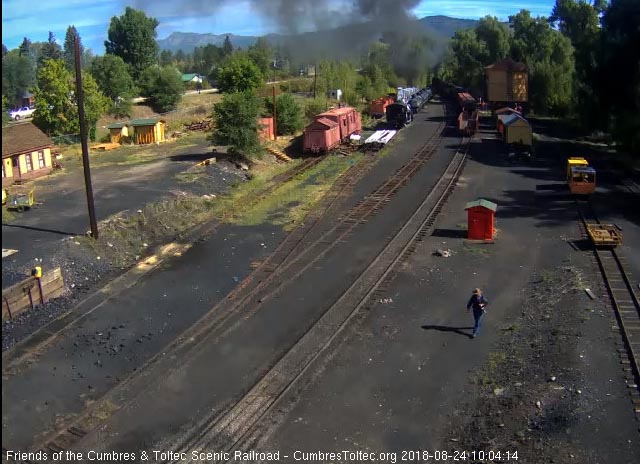 2018-08-24 The locomotives are in the curve as the last car passes the tank.jpg