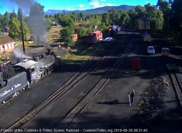 2018-08-26 As a railfan looks on, coal is added to the bunker of 489.jpg