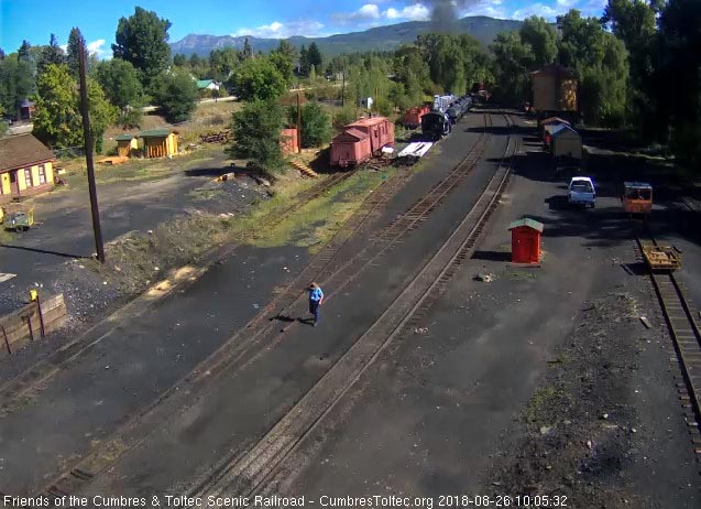 2018-08-26 The last cars are rounding the curve as the speeders get on the main to follow.jpg