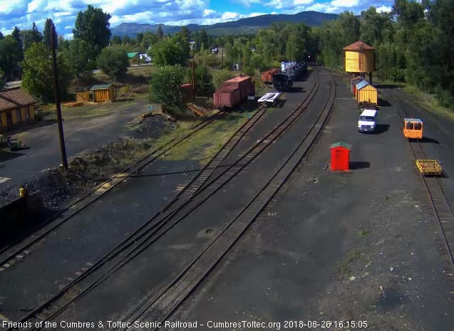 2018-08-26 The 487 brings a 7 car train 215 into Chama yard.jpg