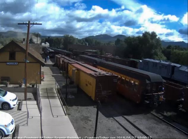 2018-08-27 As the train starts to move, the conductor is seen checking the train.jpg